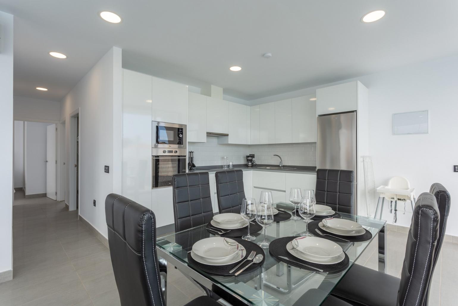 Dining area and equipped kitchen