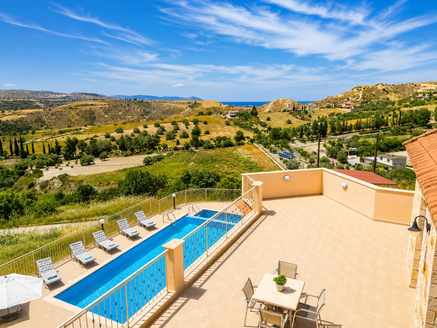 Spacious terrace with a private pool and stunning panoramic countryside and sea views.