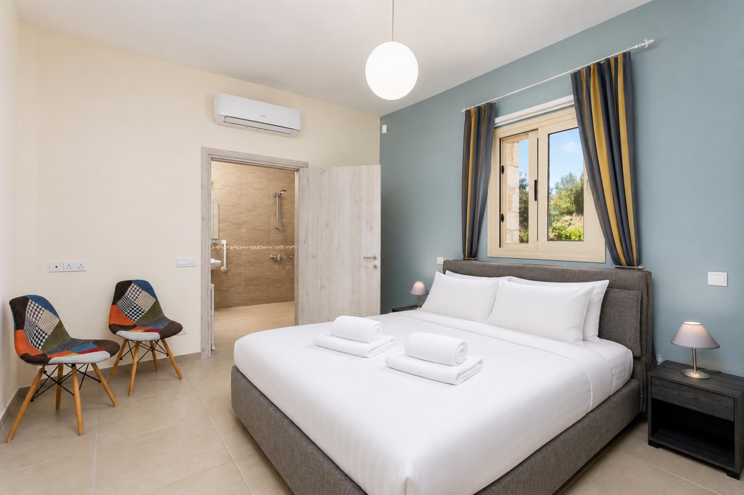 Double bedroom on ground floor with en suite bathroom and A/C