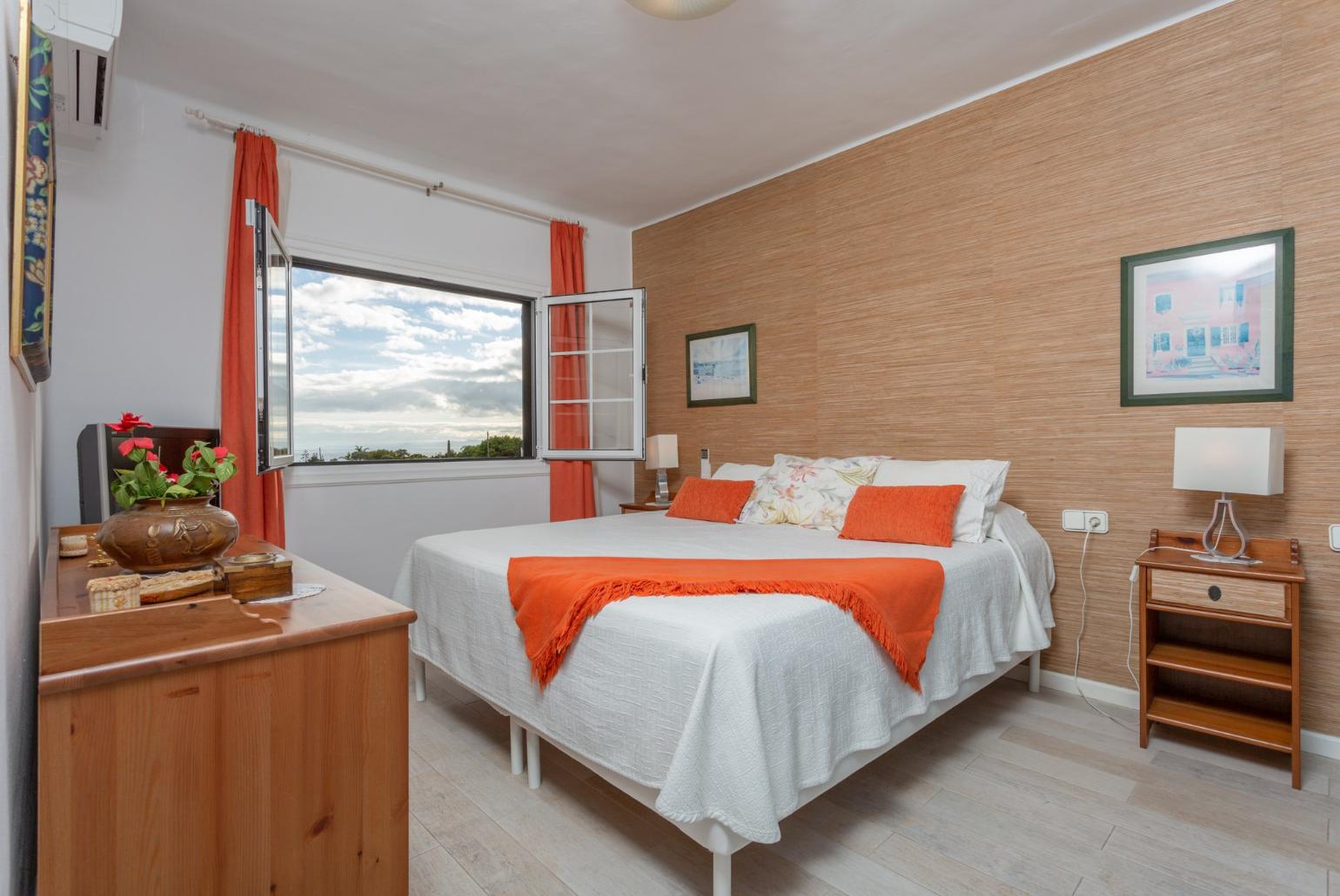 Double bedroom with en suite bathroom, A/C, and sea views