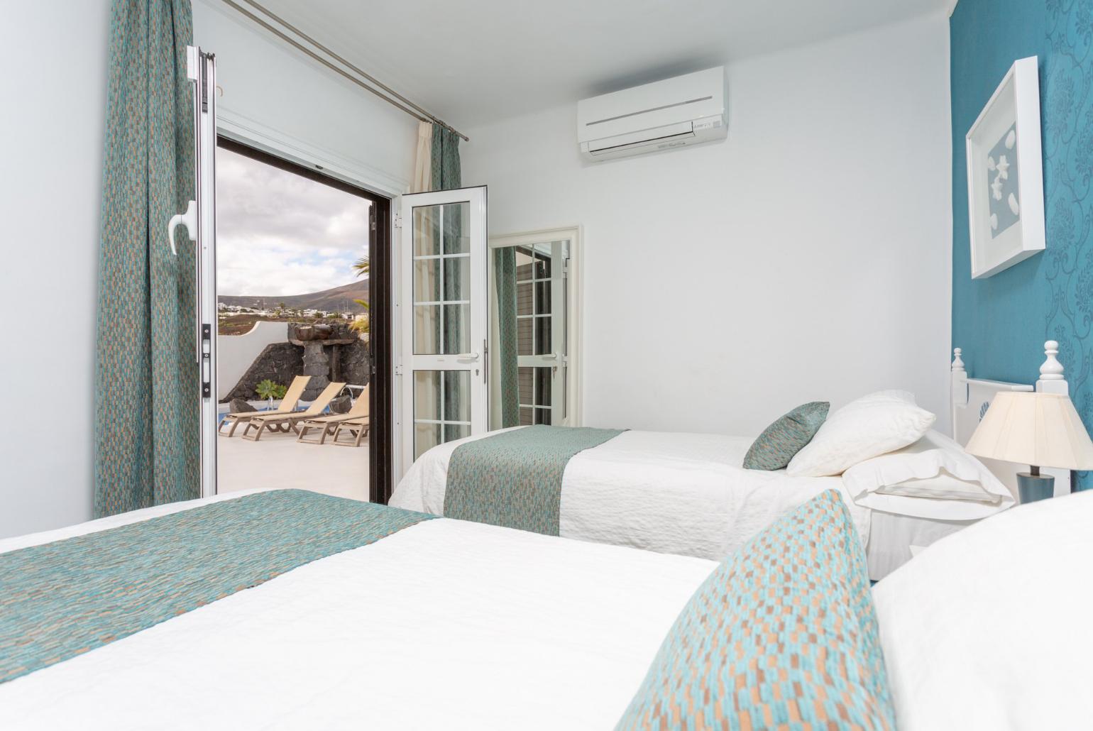 Twin bedroom with A/C and pool terrace access