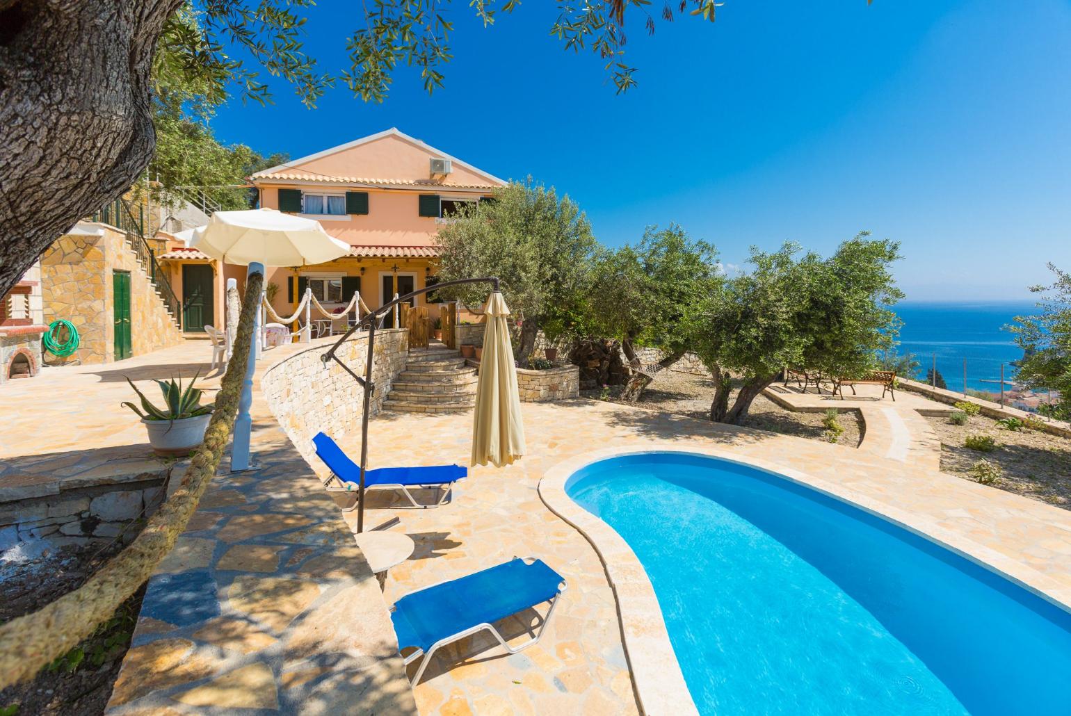 Beautiful villa with private pool, multi-level terrace area, and sea views
