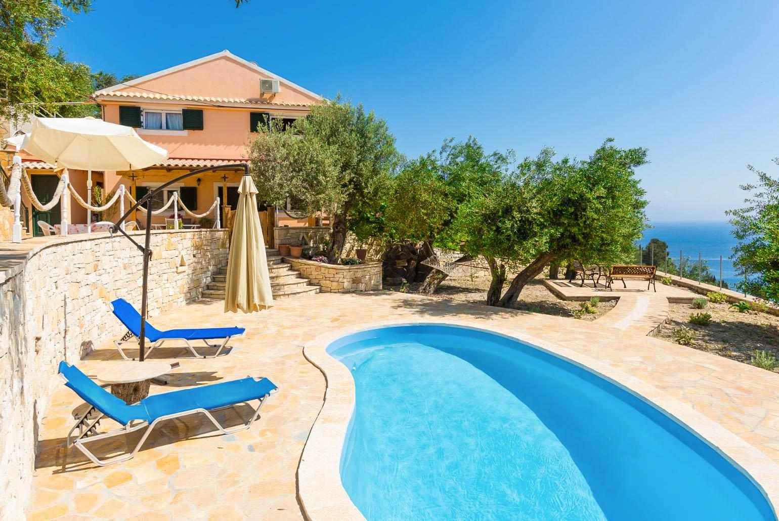 ,Beautiful villa with private pool, multi-level terrace area, and sea views