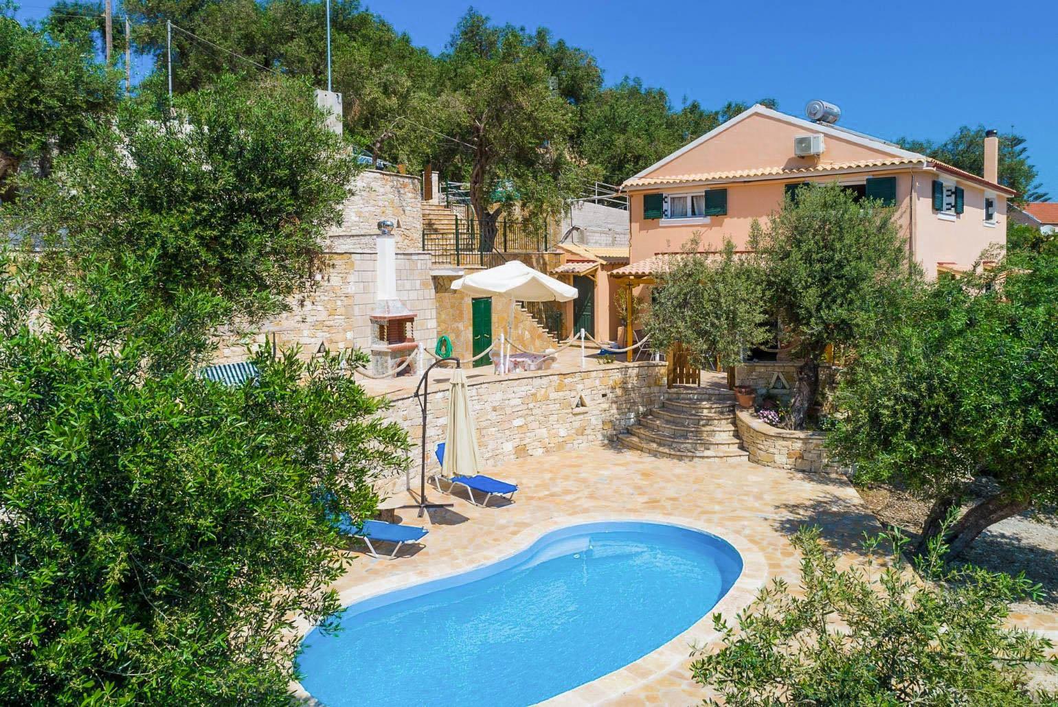 Beautiful villa with private pool, multi-level terrace area, and sea views