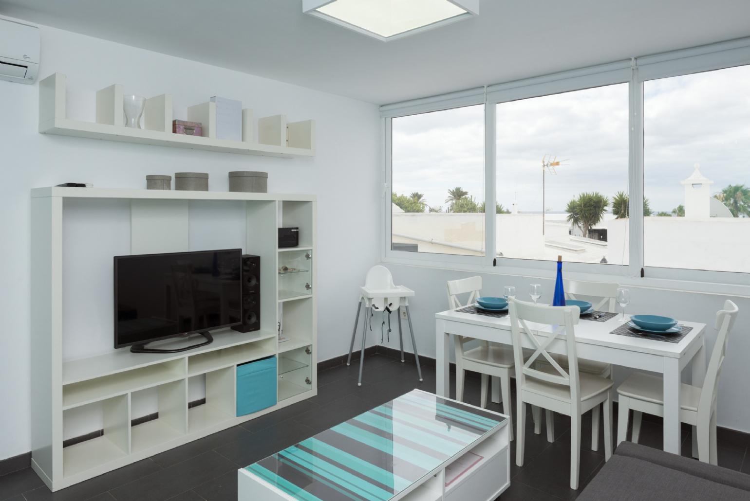 Open-plan living room with kitchen and dining area