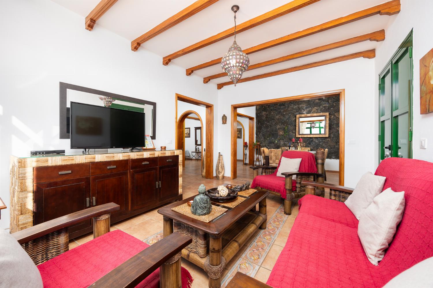 Living room with sofa, dining area, WiFi internet, satellite TV, and sea views