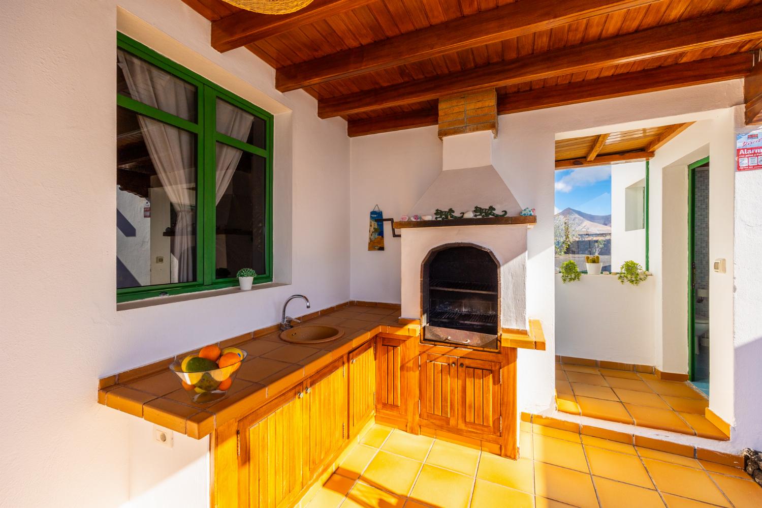 Sheltered terrace area with BBQ