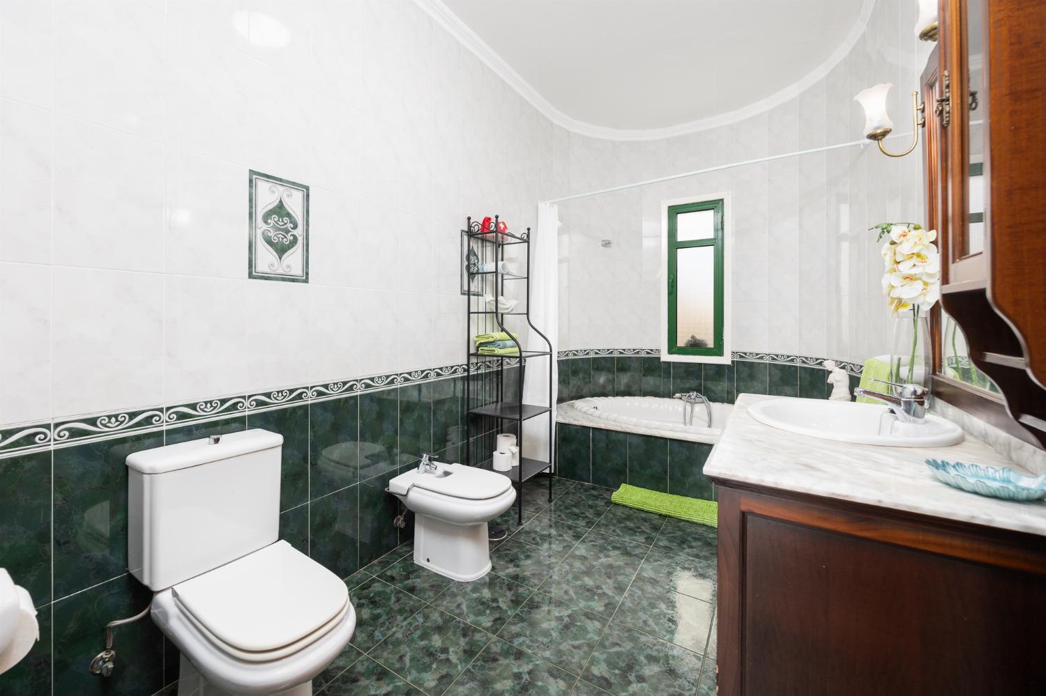 Family bathroom with bath and shower