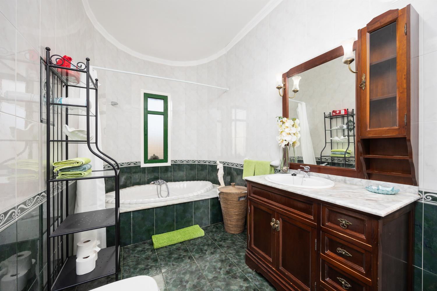 Family bathroom with bath and shower