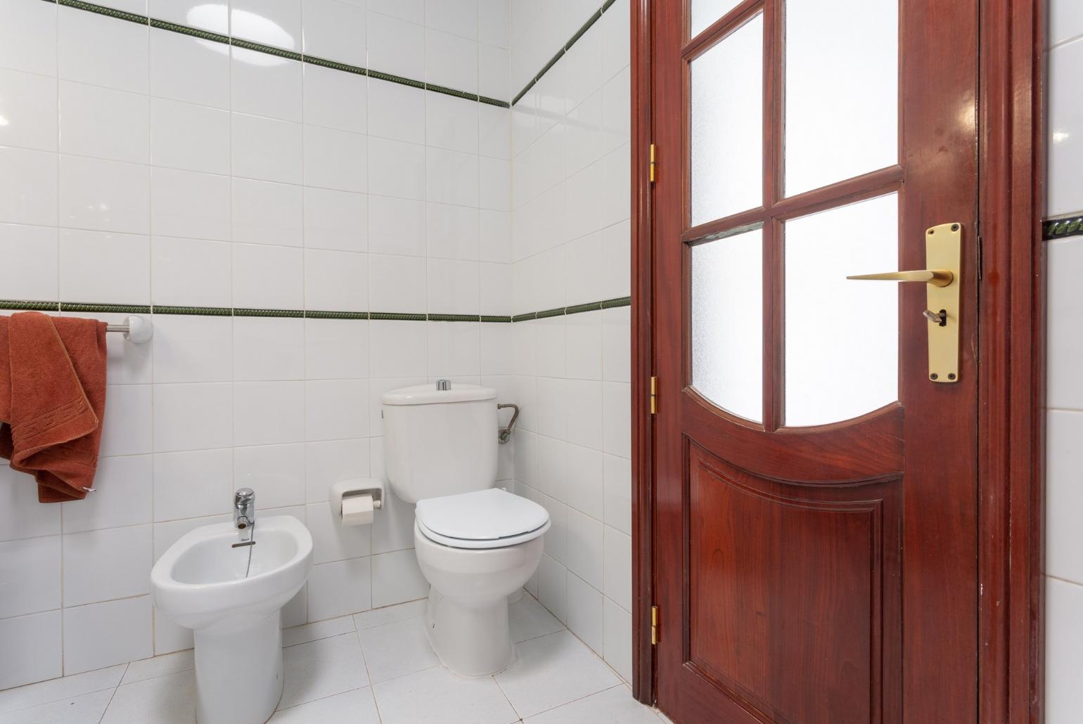 Family bathroom with overhead shower