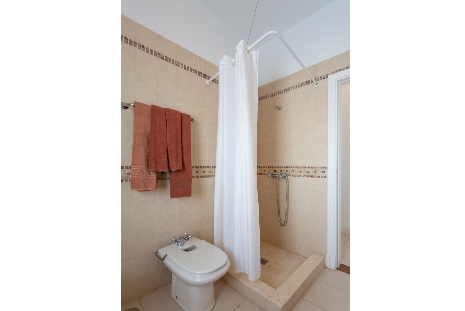 En suite bathroom with overhead shower