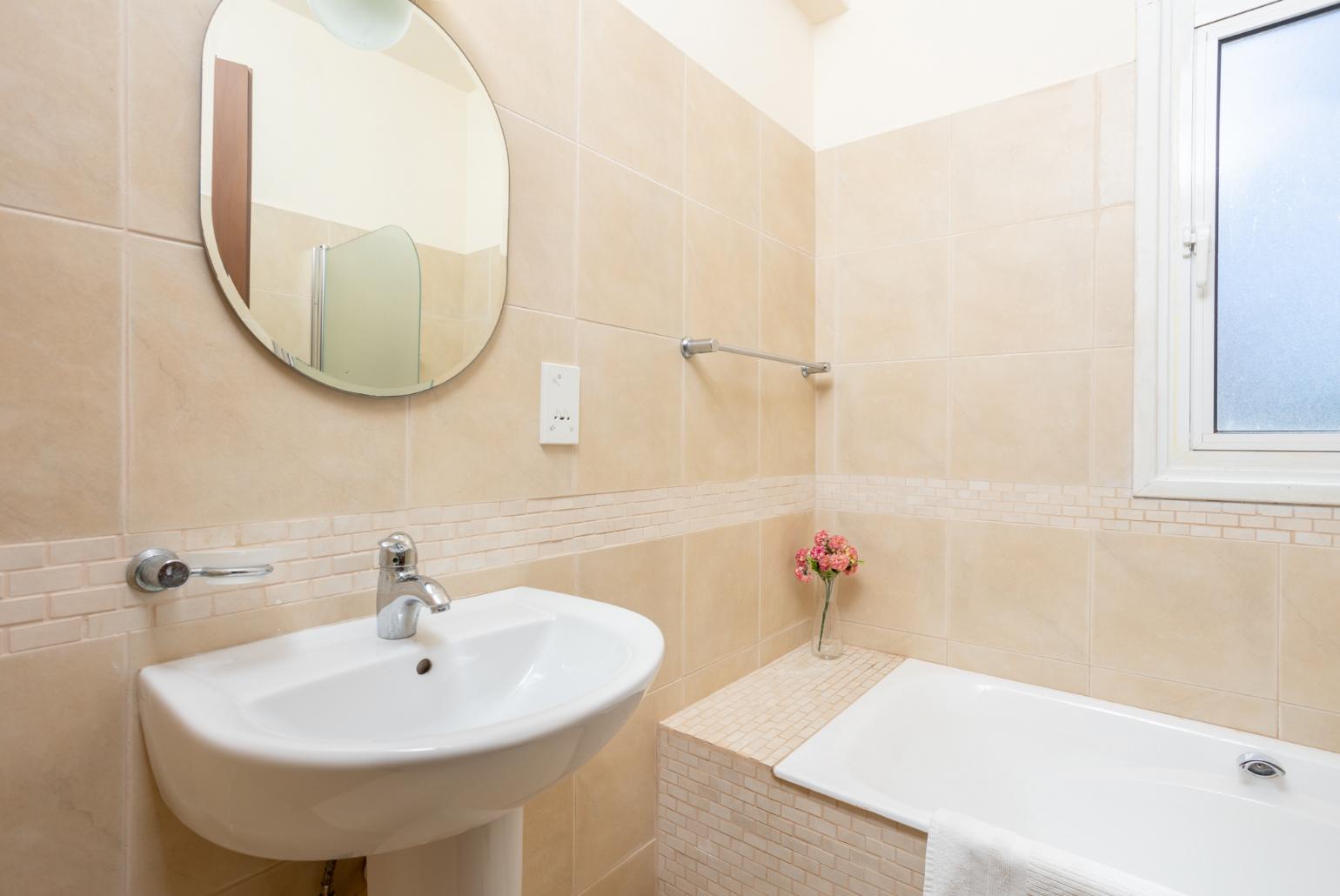 Family bathroom with bath and shower