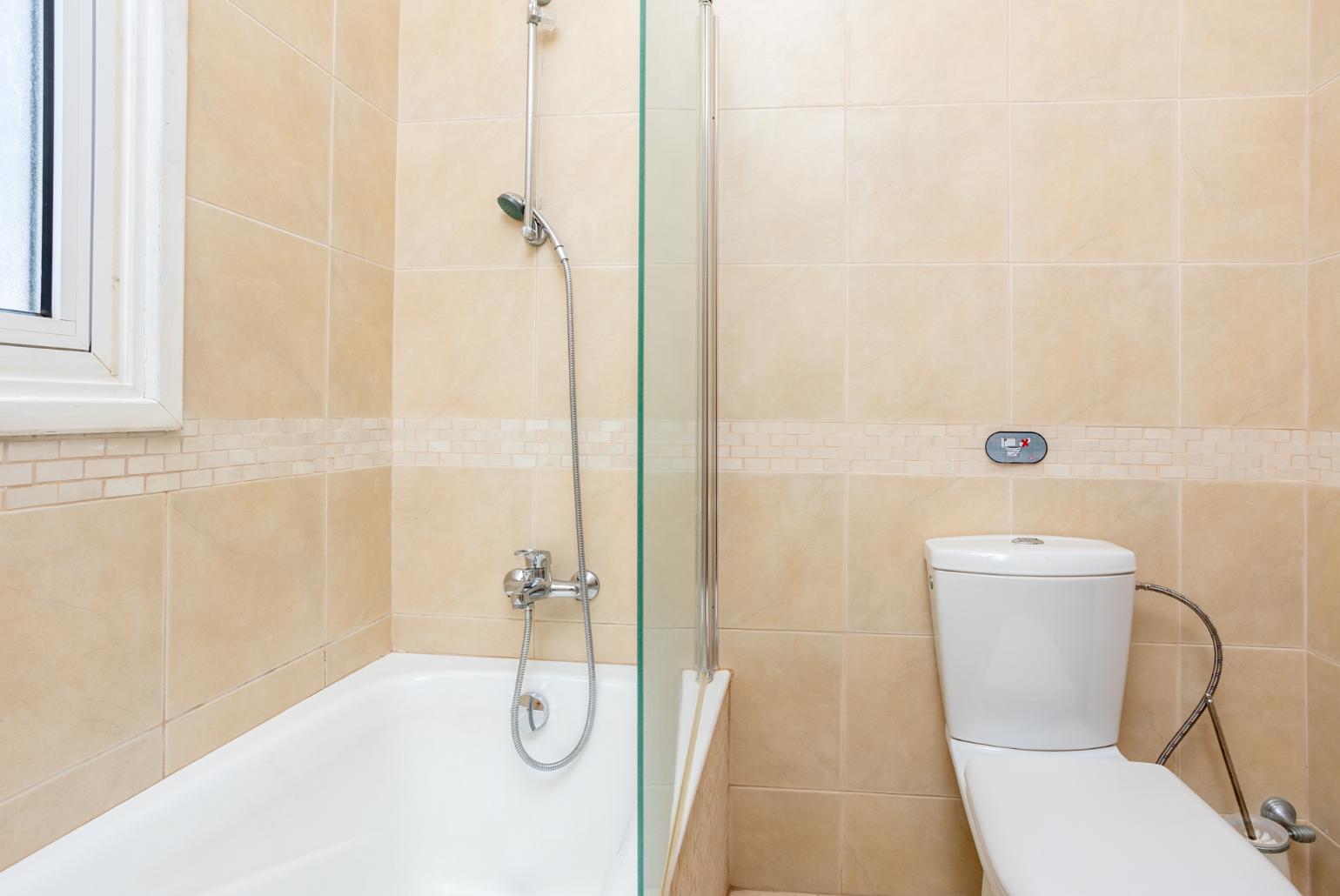 Family bathroom with bath and shower