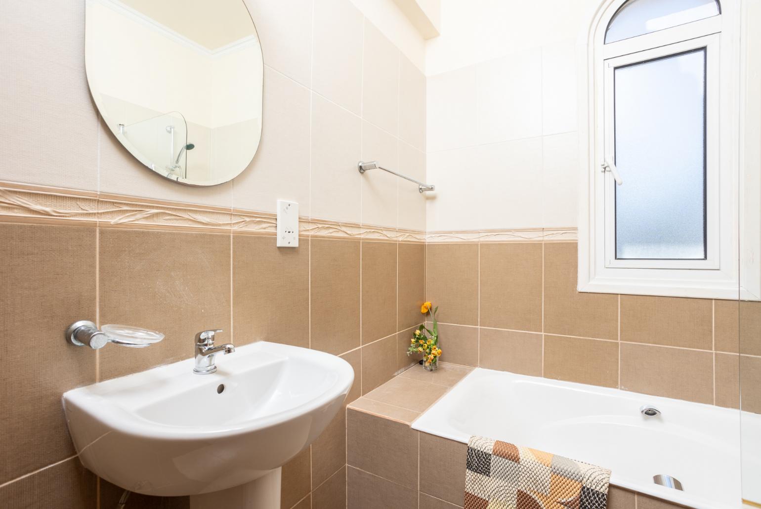 Family bathroom with bath and shower