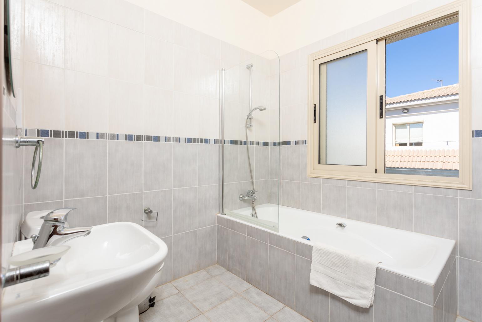 Family bathroom with bath and shower