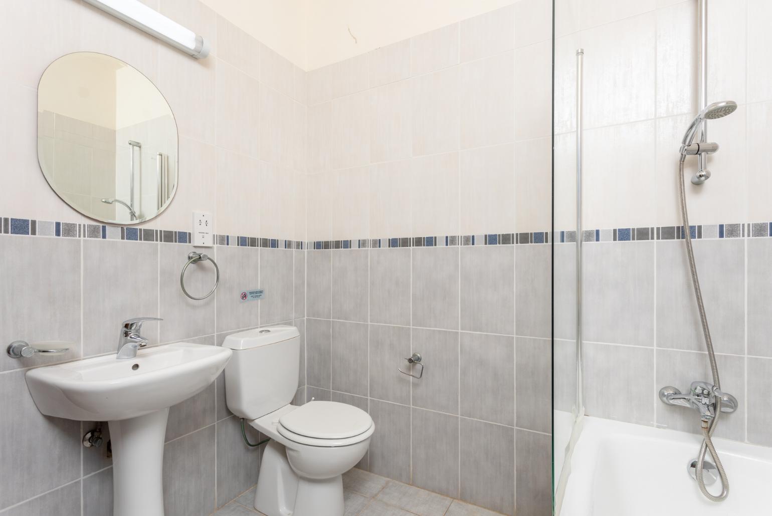 Family bathroom with bath and shower