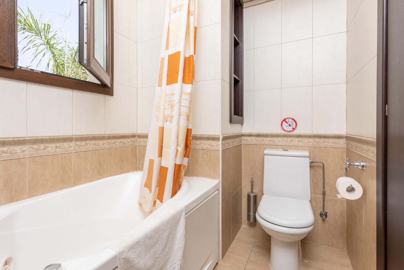 Family bathroom with bath and shower