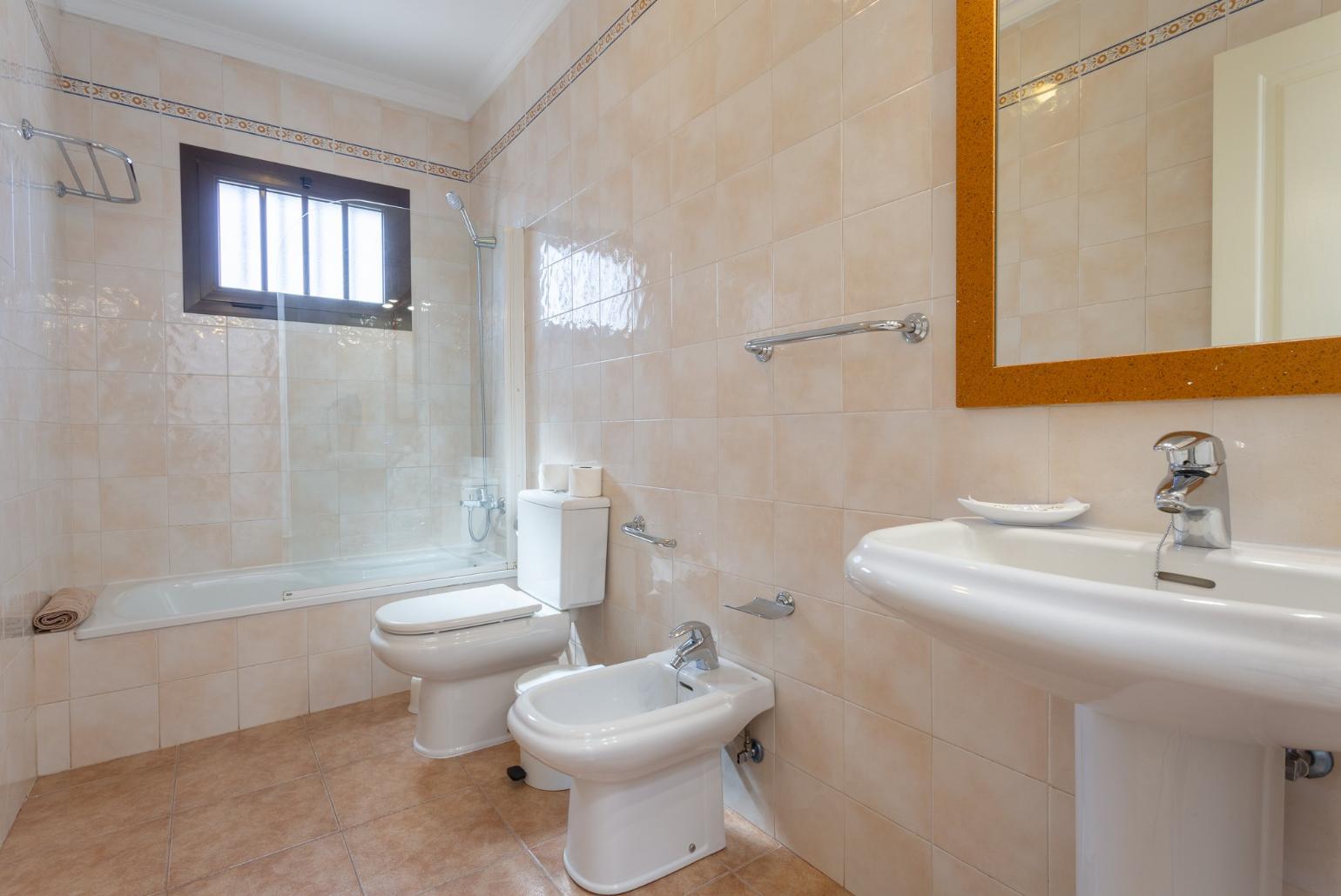 Family bathroom with overhead shower