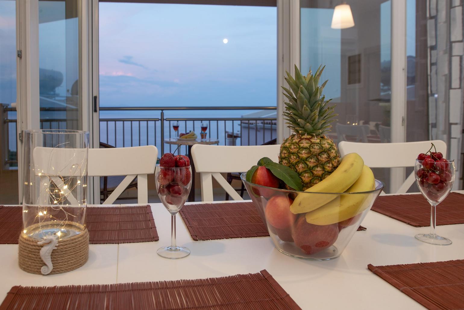 Dining room with A/C and balcony access with panoramic sea views
