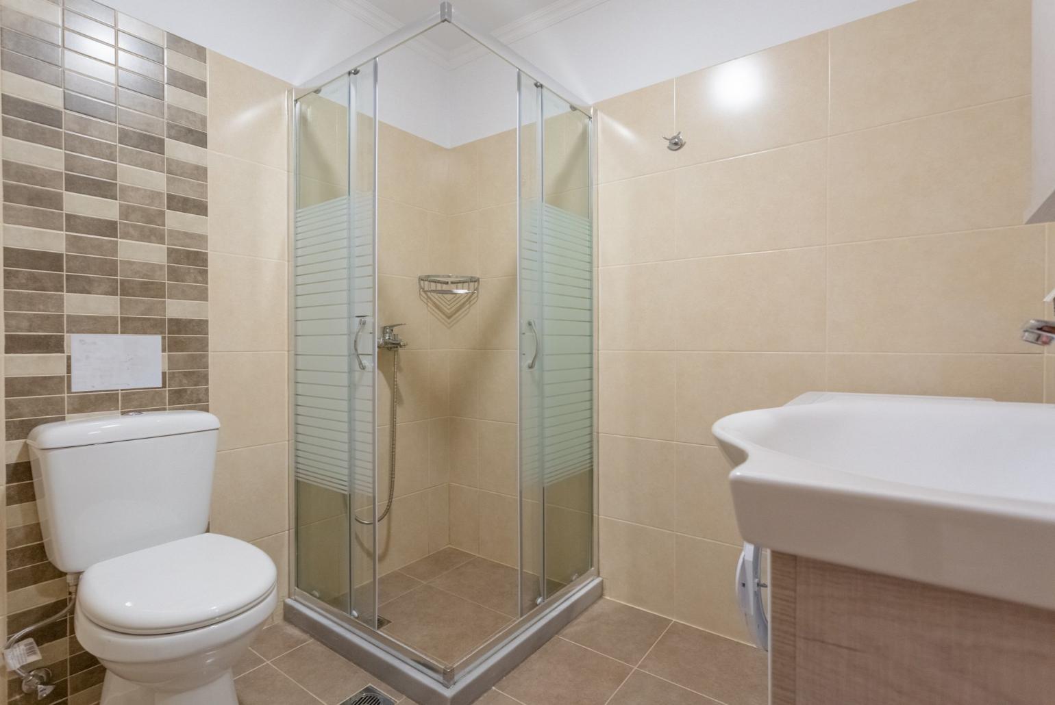 Family bathroom with overhead shower