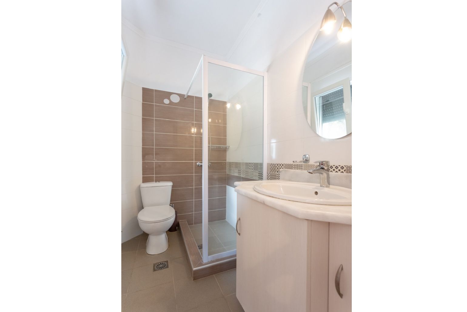 Family bathroom with overhead shower