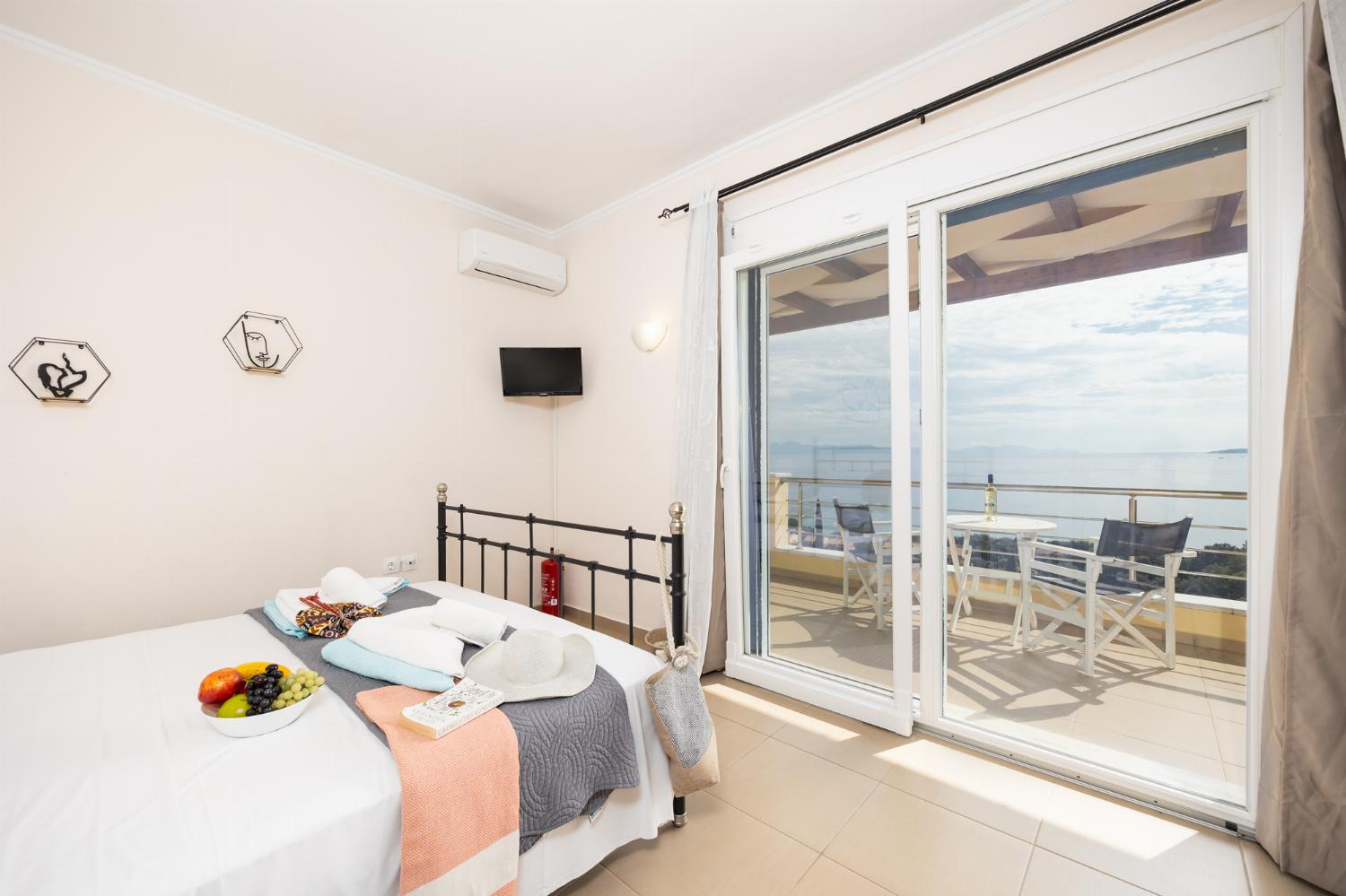 Double bedroom with en suite bathroom, A/C, and sea views