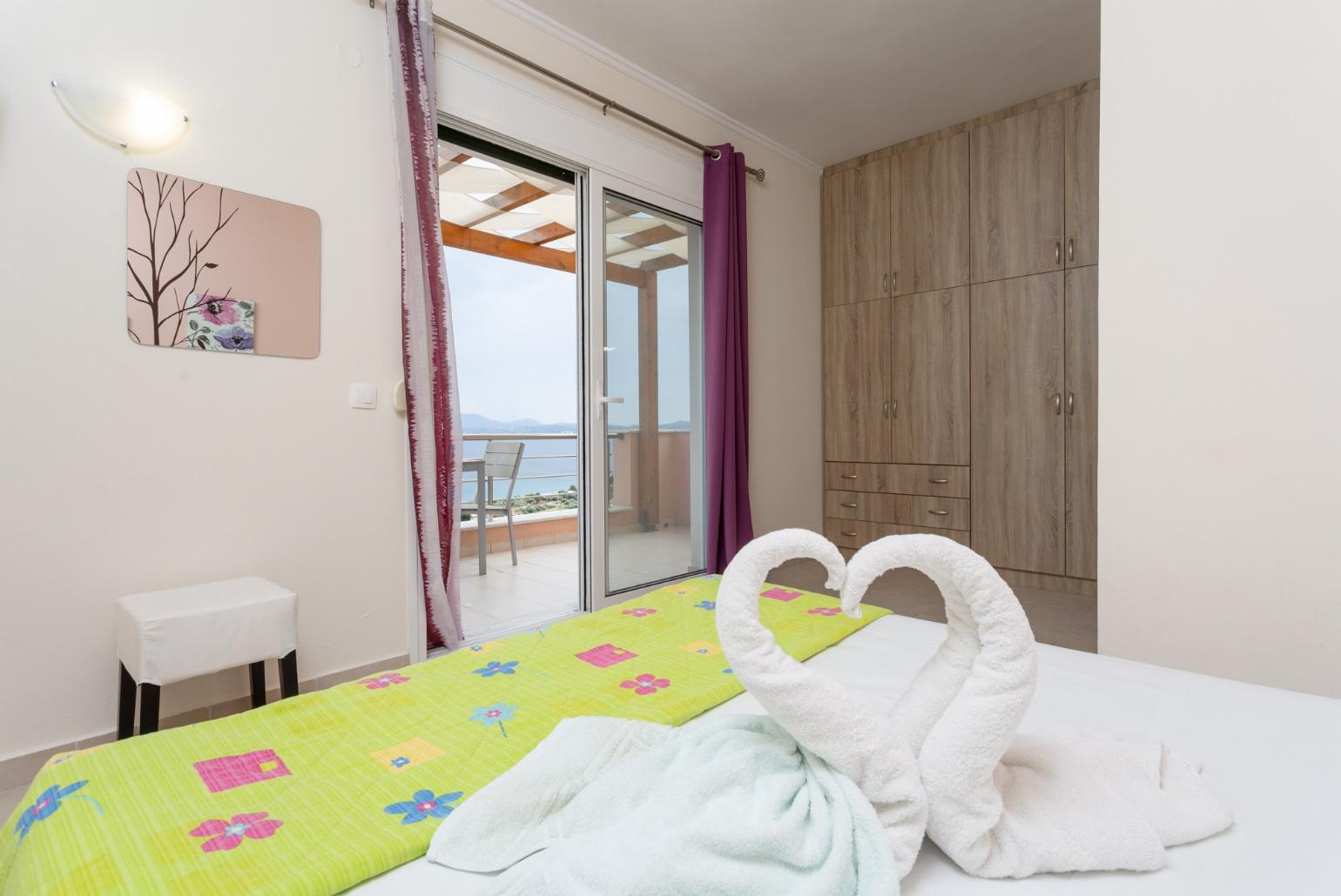 Double bedroom with en suite bathroom, A/C, TV. and balcony access with sea views