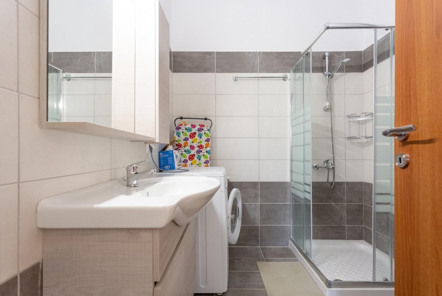 Family bathroom with overhead shower