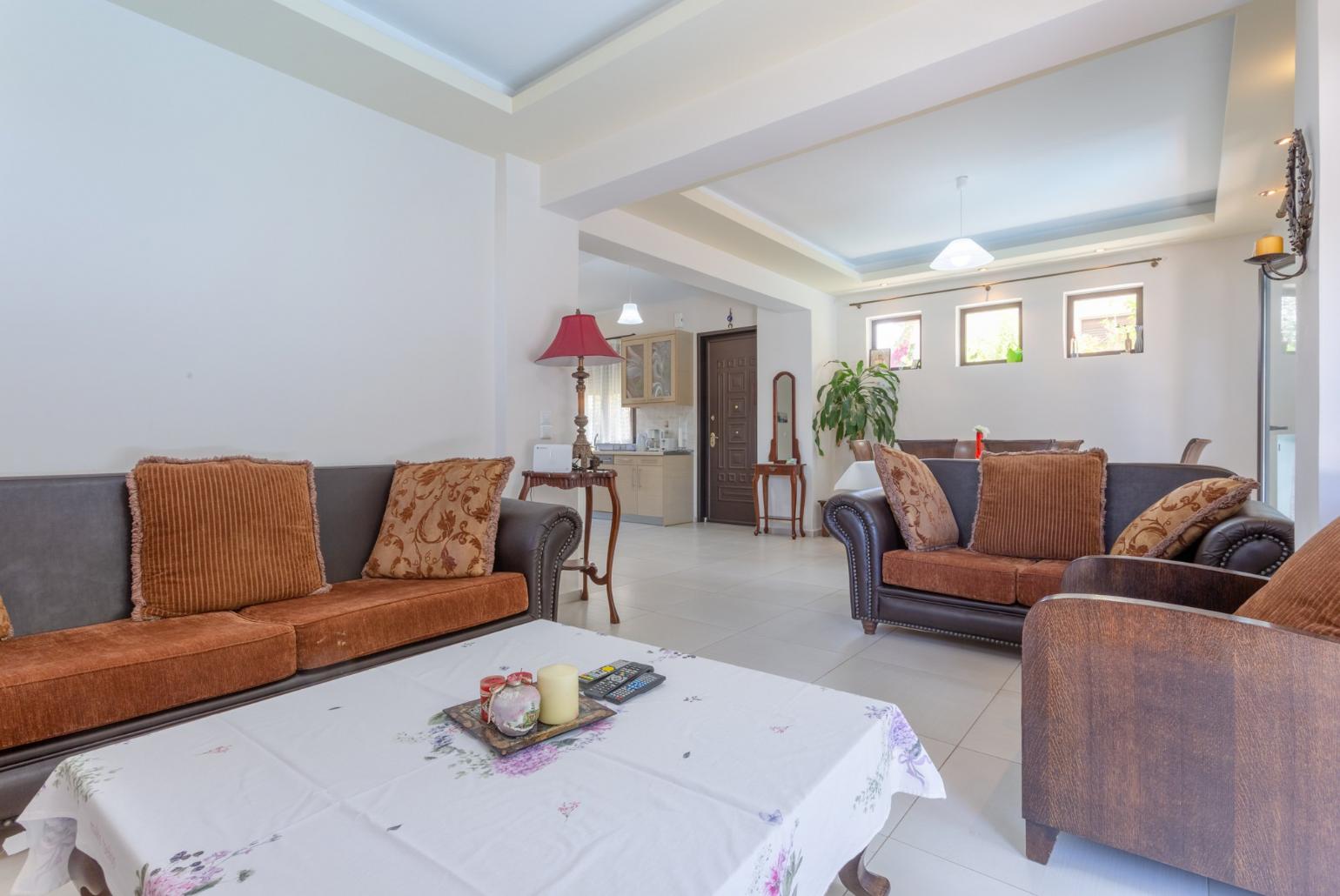 Open-plan living room with dining area, kitchen, A/C, WiFi Internet, Satellite TV, and pool terrace access