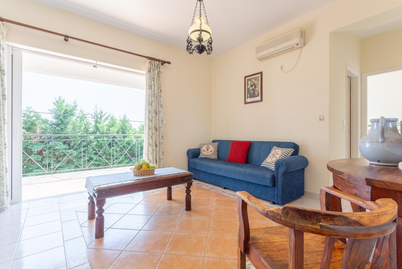 Living room on first floor with A/C, WiFi Internet, and balcony access