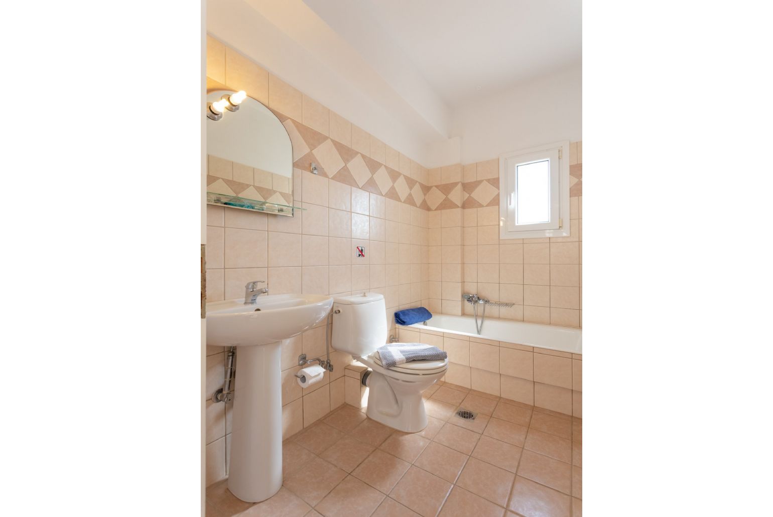 Family bathroom with bath and overhead shower