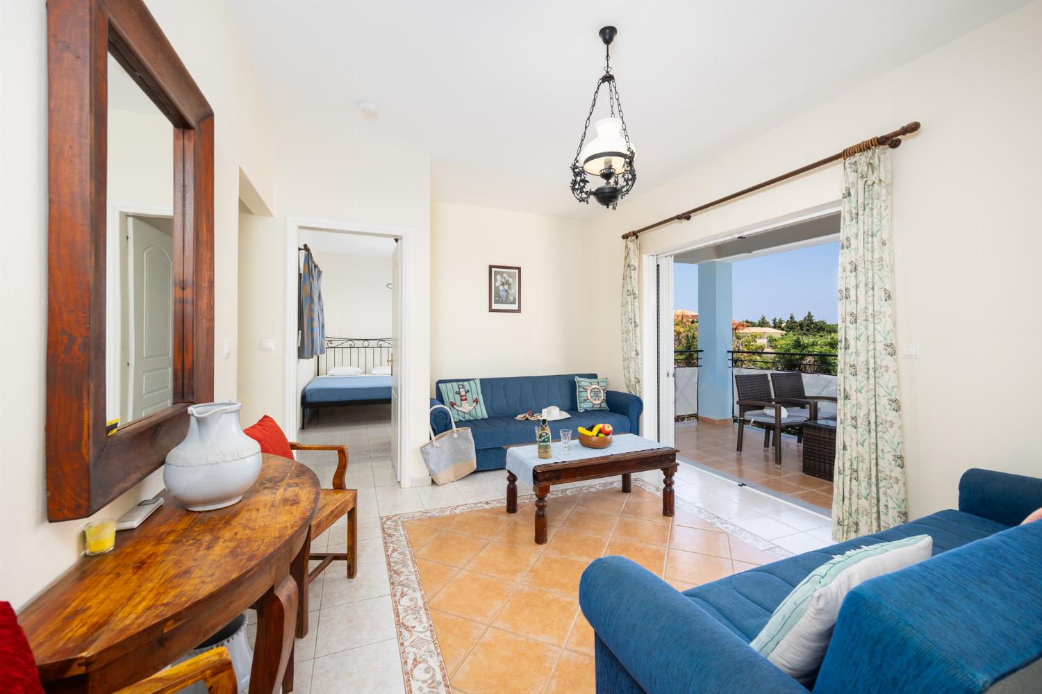 Living room with sofas, A/C, and WiFi internet