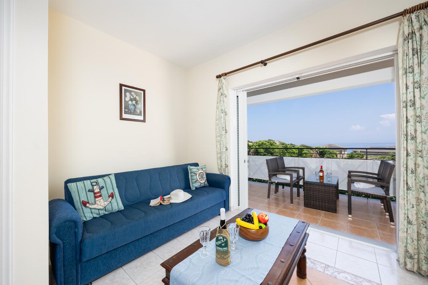 Living room with sofas, A/C, and WiFi internet