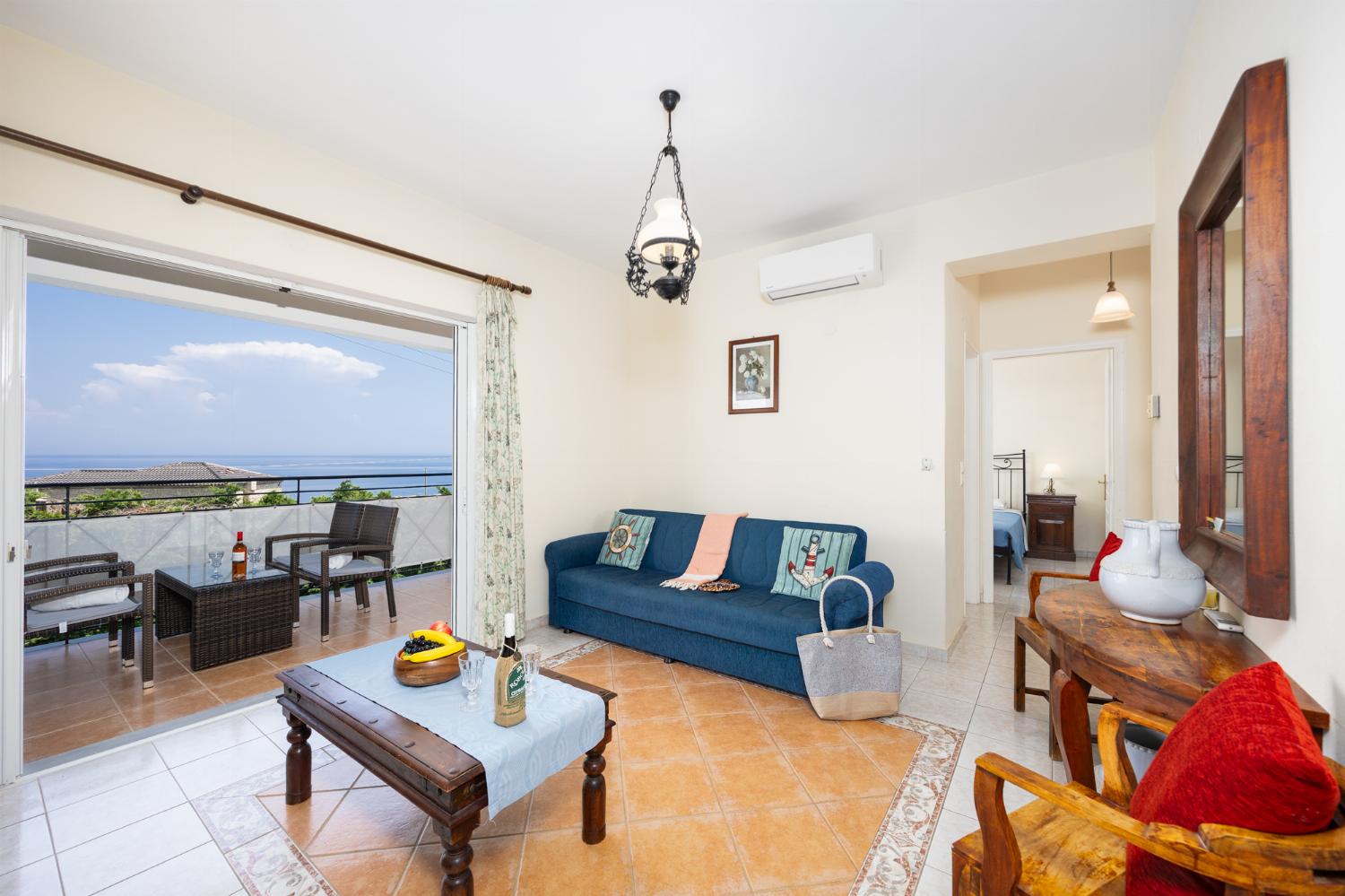 Living room with sofas, A/C, and WiFi internet