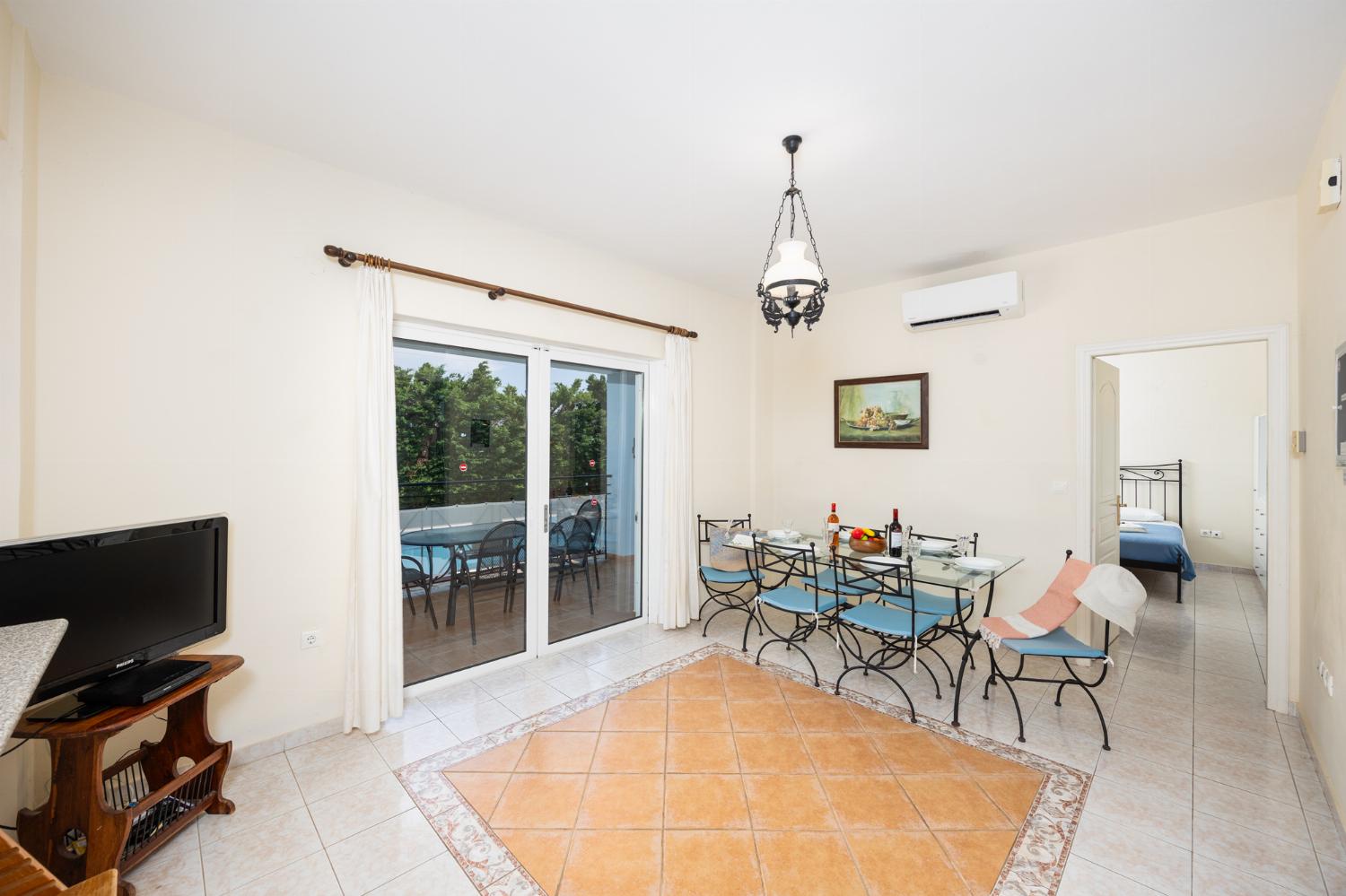 Dining room with kitchen, A/C, WiFi internet, and satellite TV