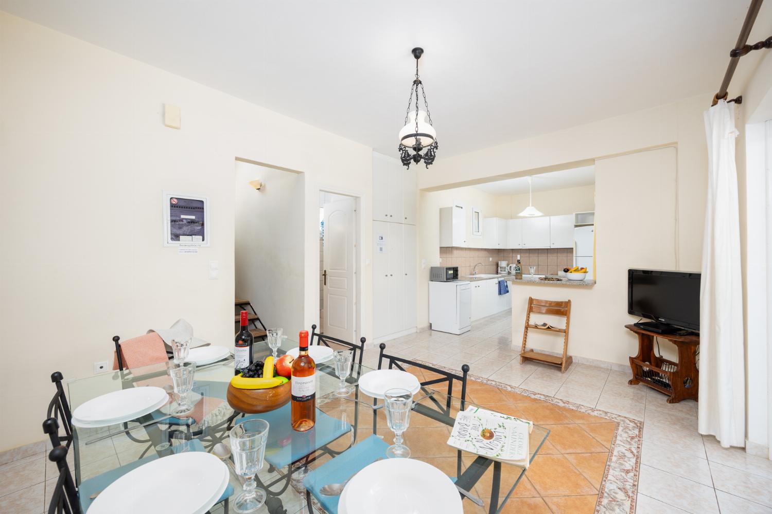 Dining room with kitchen, A/C, WiFi internet, and satellite TV