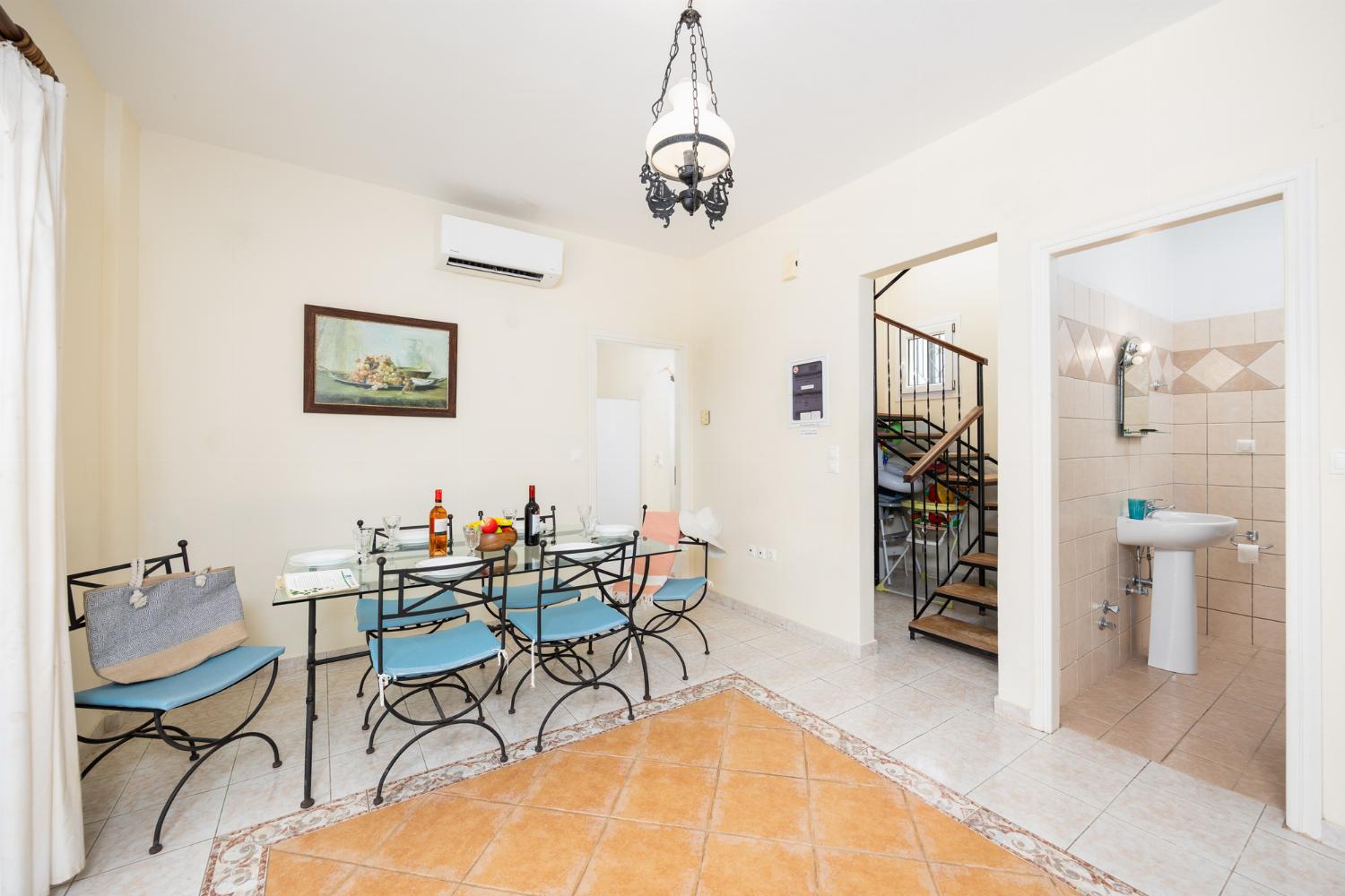 Dining room with kitchen, A/C, WiFi internet, and satellite TV