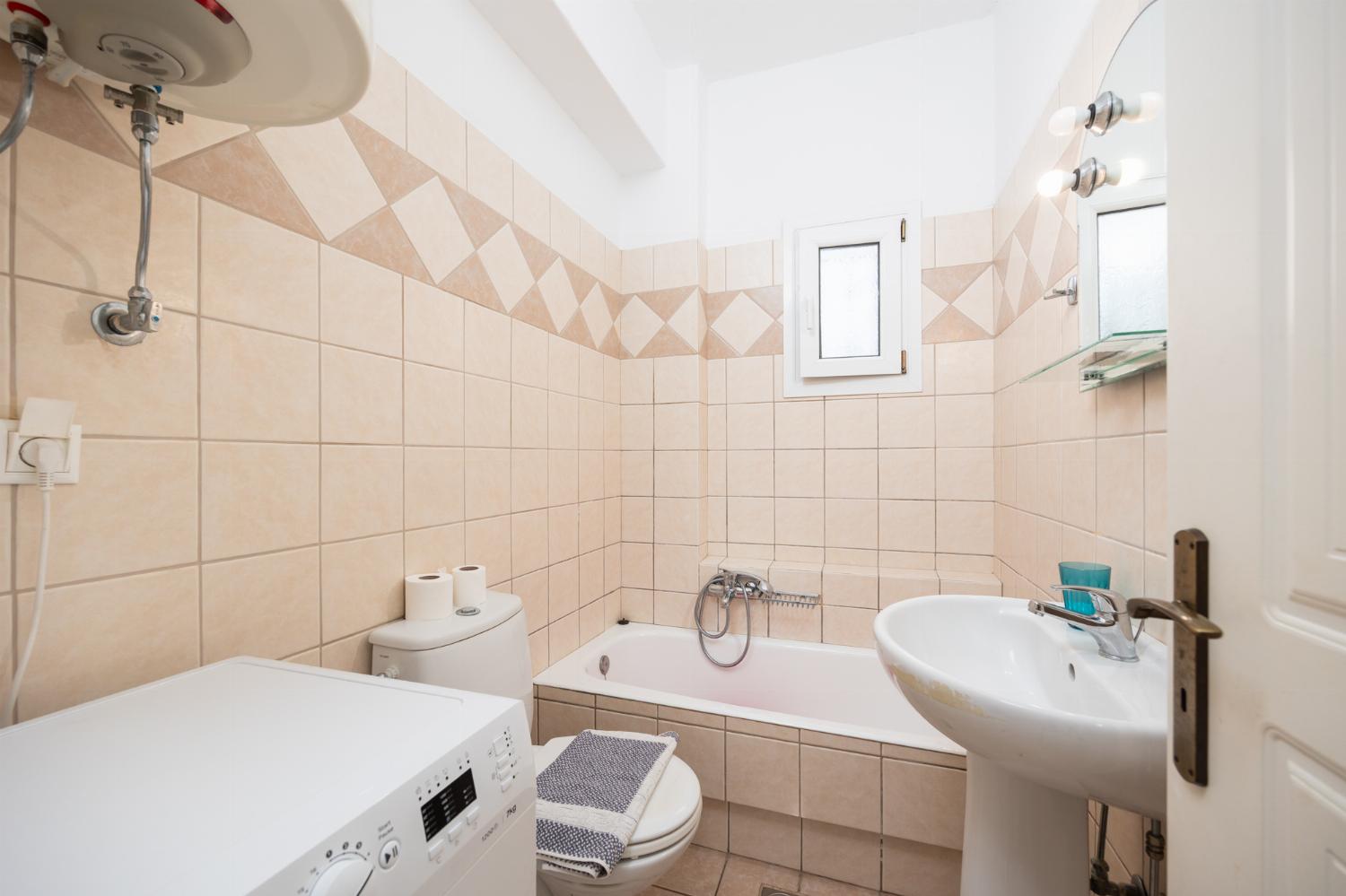 En suite bathroom with bath and shower