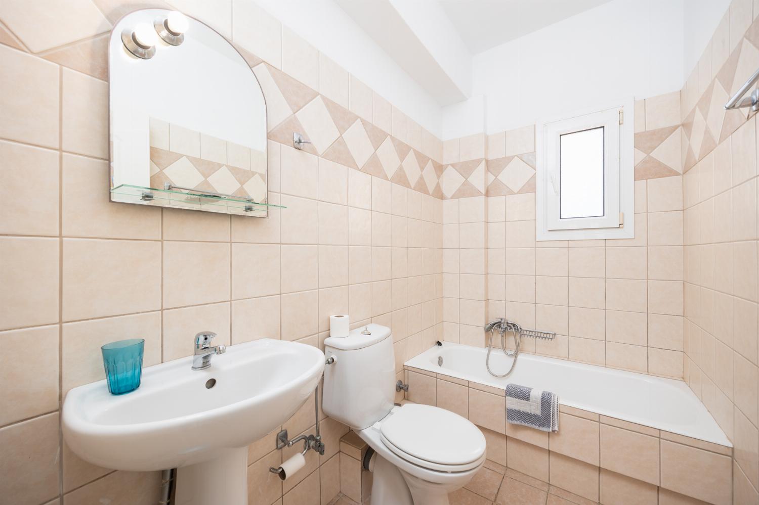 Family bathroom with bath and shower
