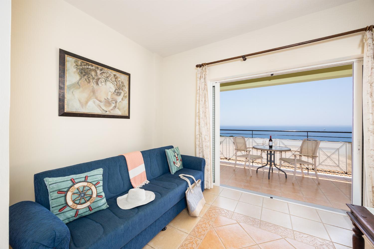 Living room with sofas, A/C, WiFi internet, and sea views