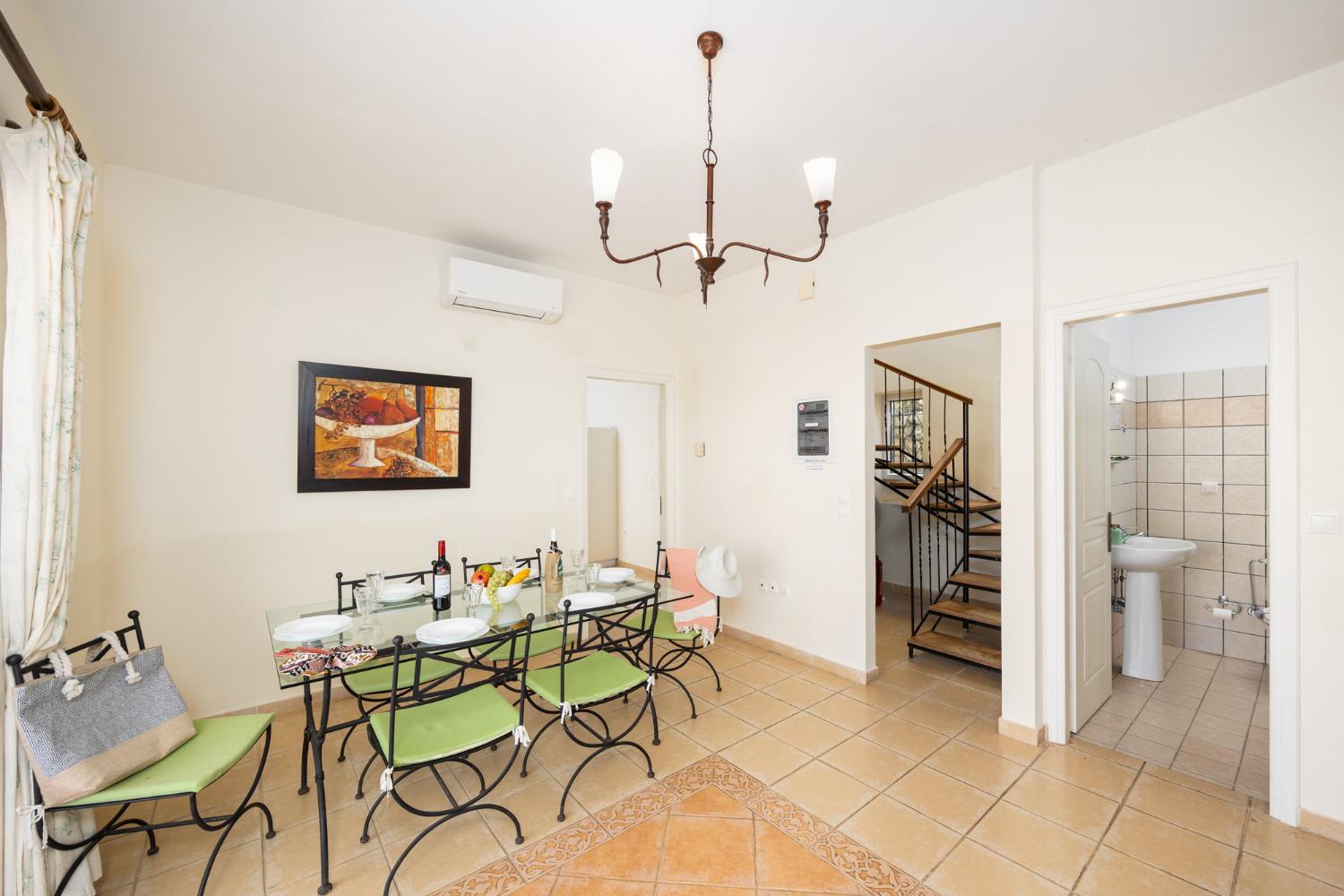 Dining room with kitchen, A/C, WiFi internet, and satellite TV