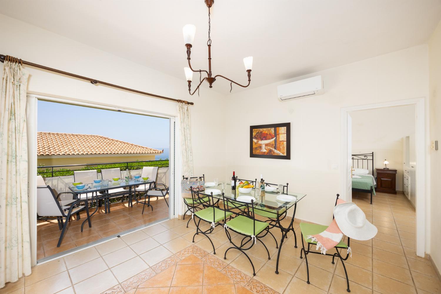 Dining room with kitchen, A/C, WiFi internet, and satellite TV