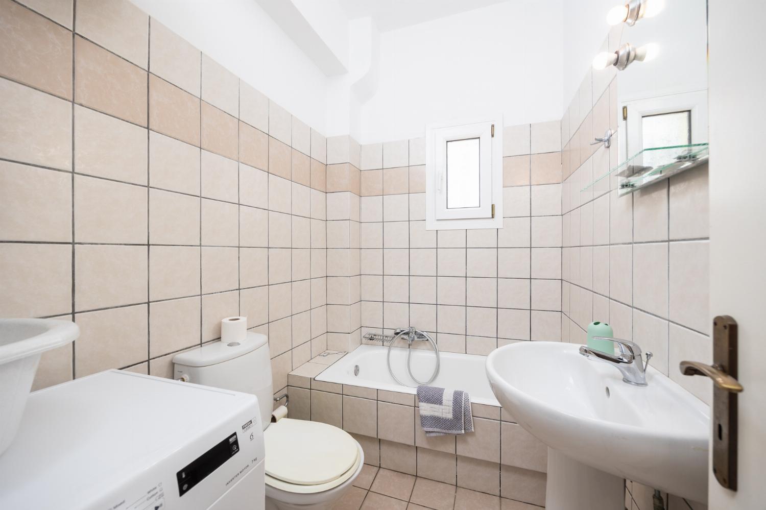 En suite bathroom with bath and shower