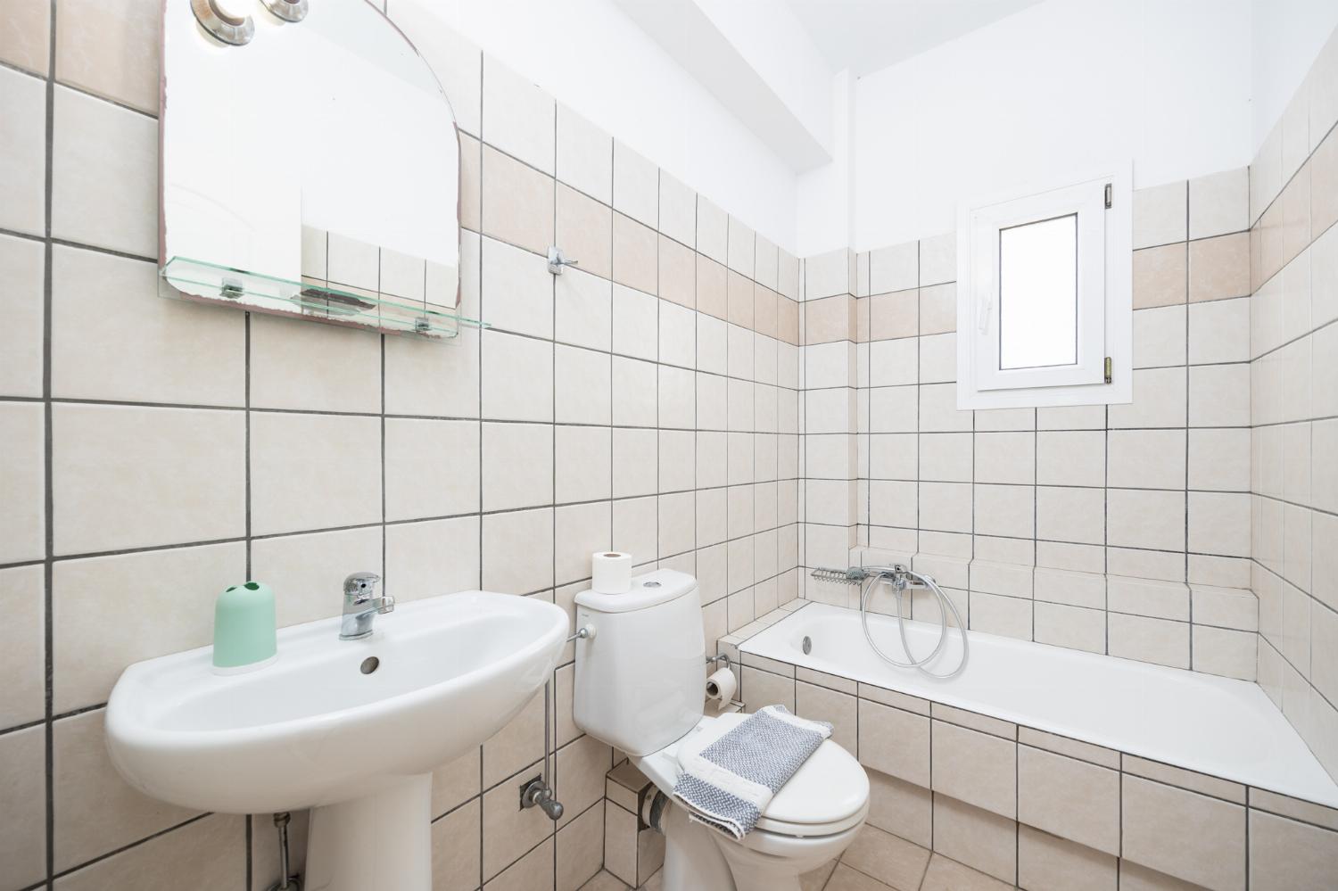 Family bathroom with bath and shower