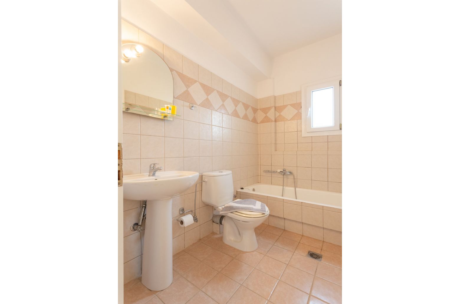 Family bathroom on first floor with bath and shower