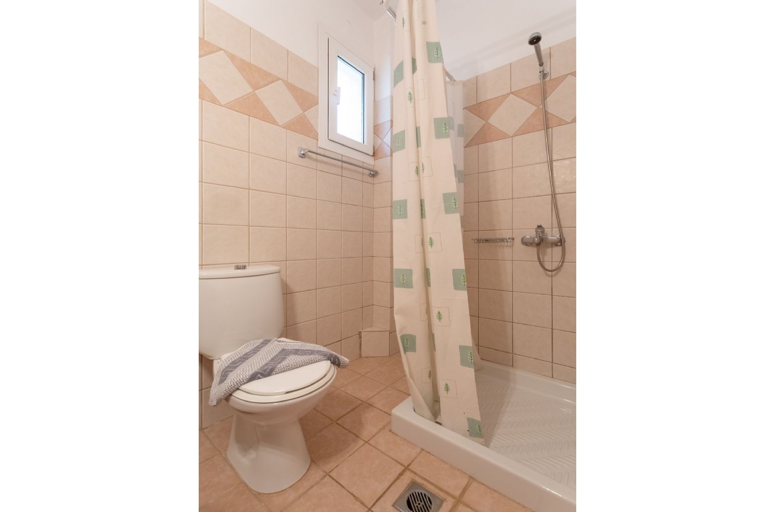 Family bathroom on ground floor with overhead shower