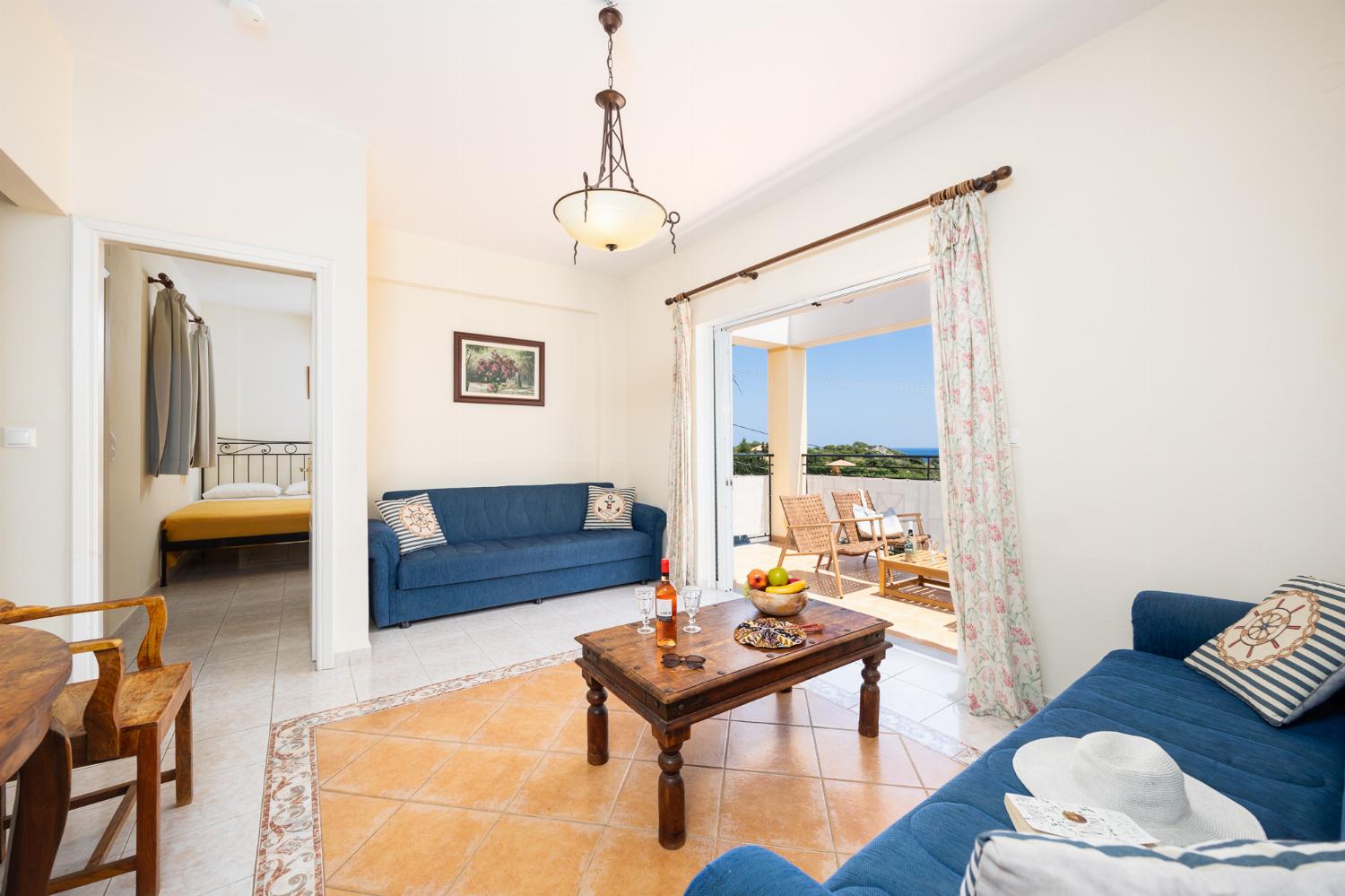 Living room with sofas, A/C, WiFi internet, and sea views