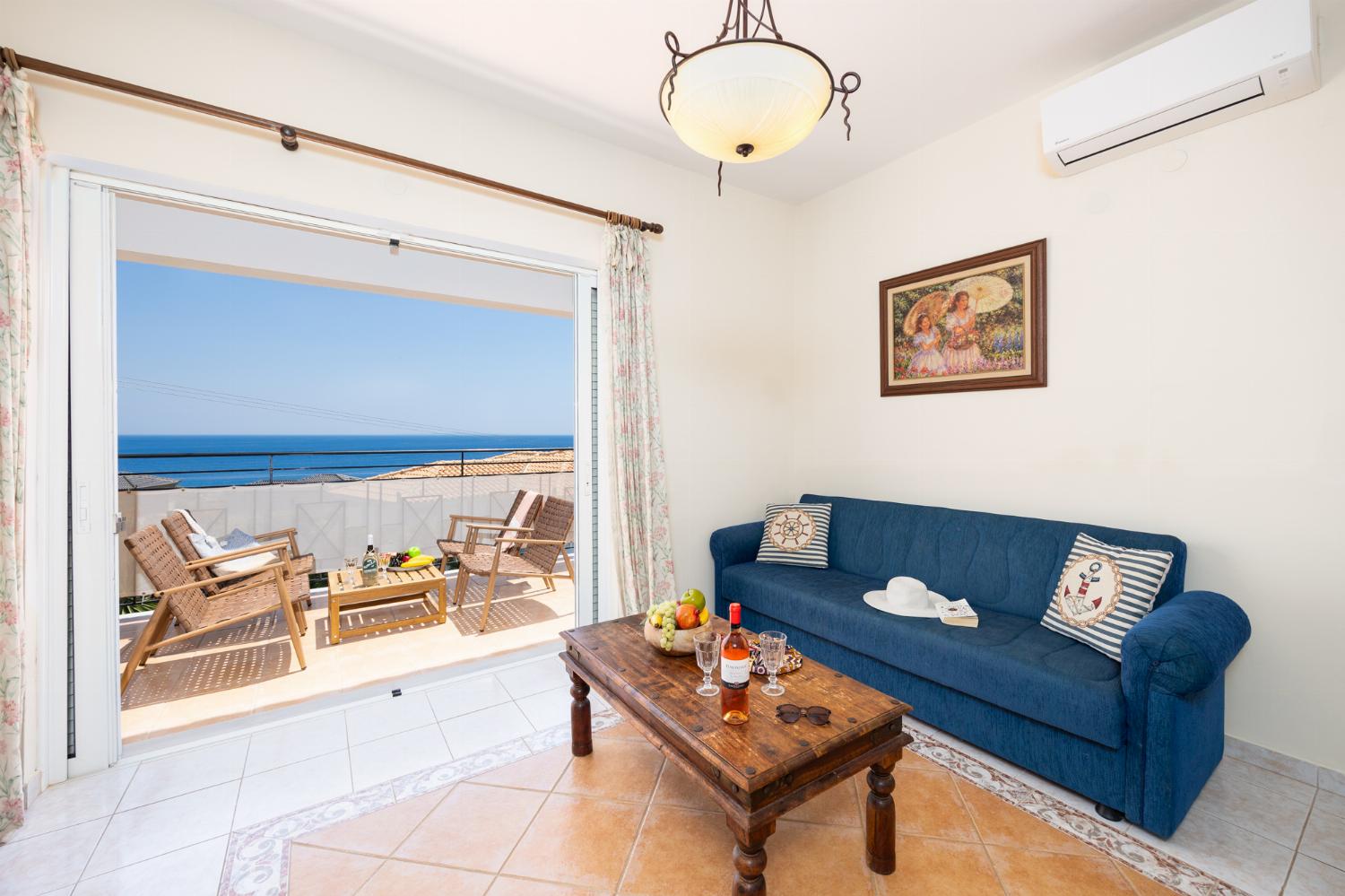 Living room with sofas, A/C, WiFi internet, and sea views