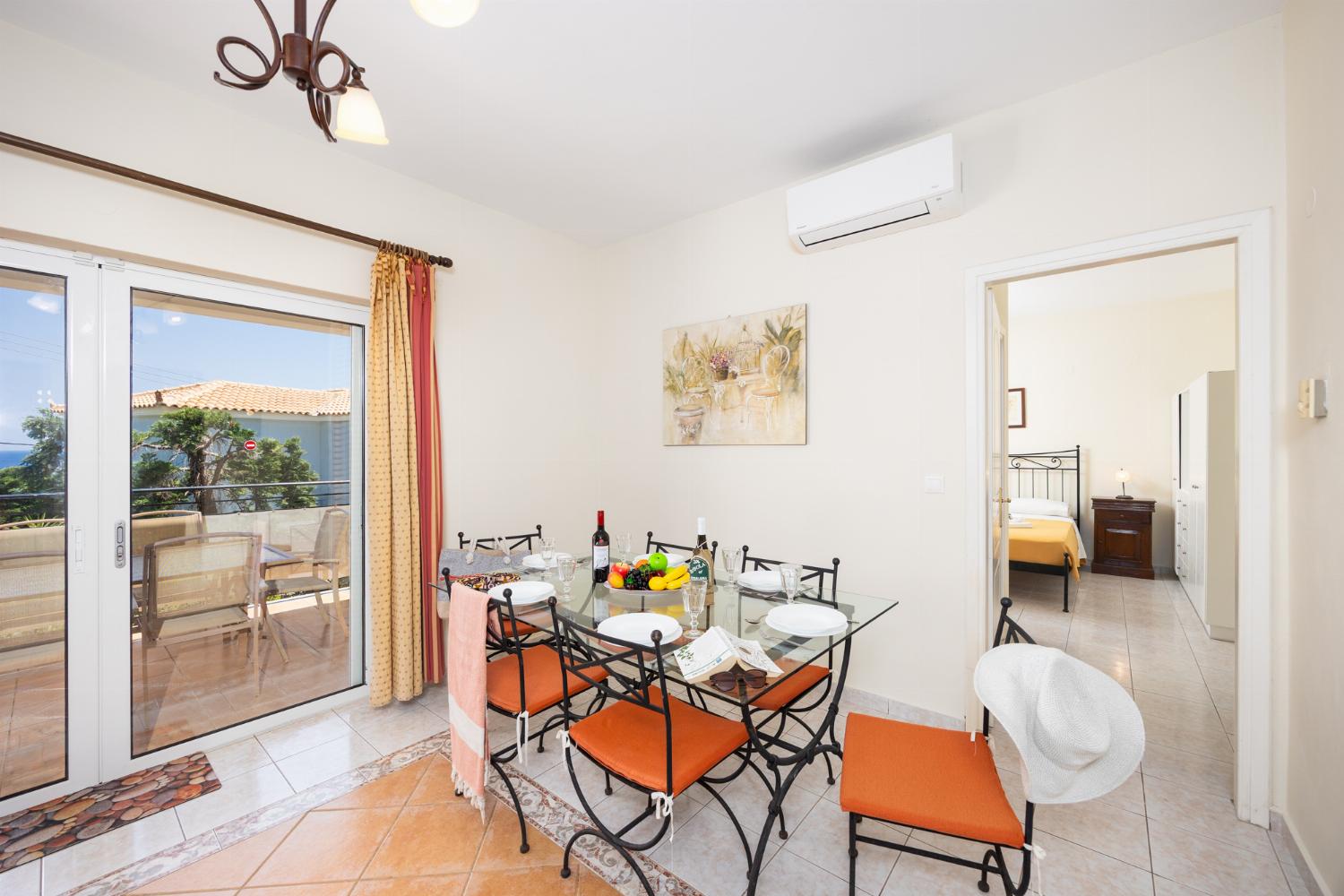 Dining room with kitchen, A/C, WiFi internet, and satellite TV