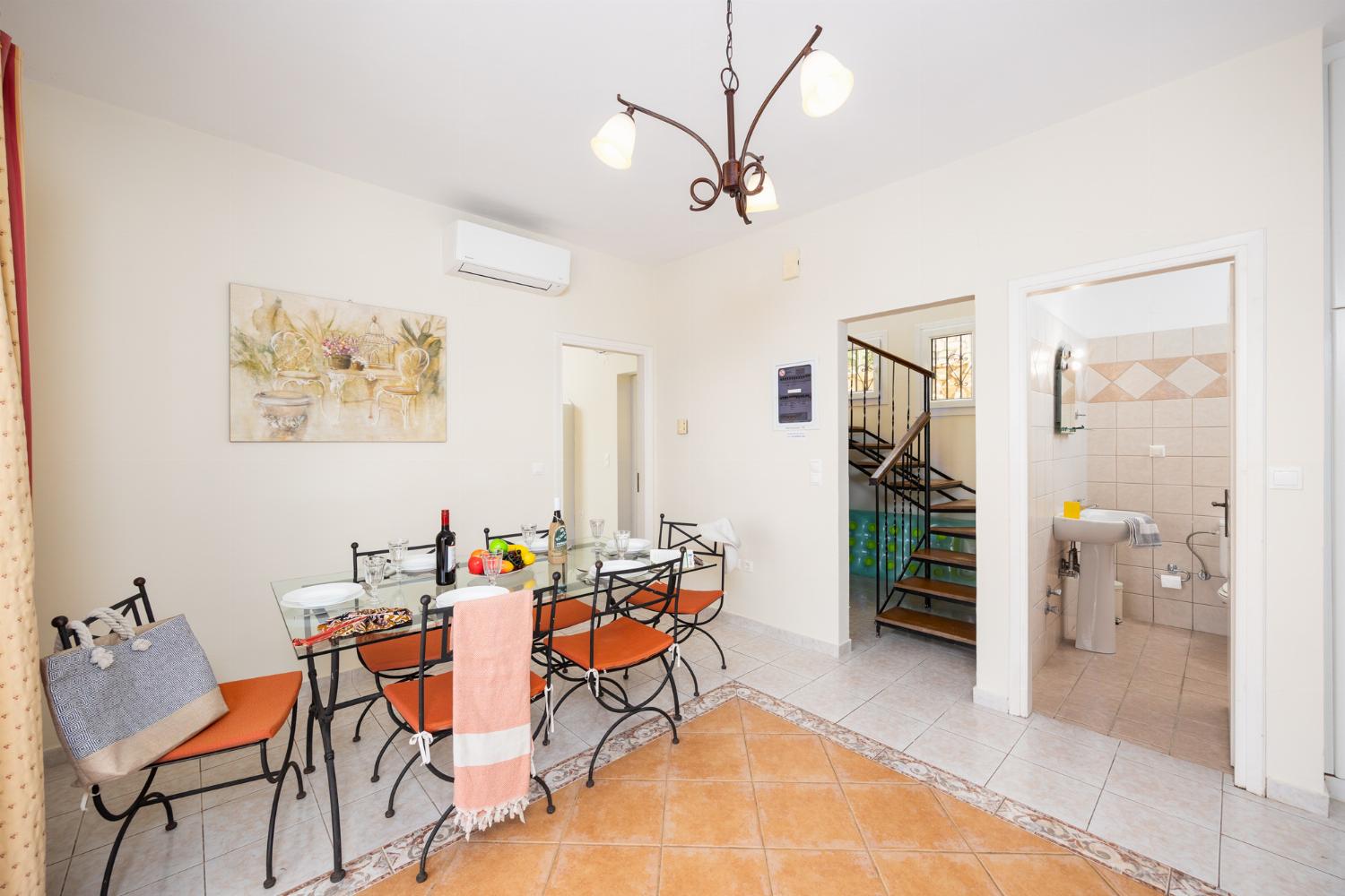 Dining room with kitchen, A/C, WiFi internet, and satellite TV